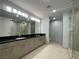 Spacious bathroom featuring double vanity sinks and granite countertops at 4525 Dean Martin Dr # 1507, Las Vegas, NV 89103