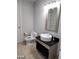 Bathroom featuring modern sink and vanity, black countertop, and tiled flooring at 4525 Dean Martin Dr # 1507, Las Vegas, NV 89103