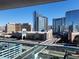 Balcony view showcasing an impressive cityscape featuring famous landmarks and bustling roads on a clear, sunny day at 4525 Dean Martin Dr # 1507, Las Vegas, NV 89103
