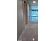 Hallway featuring tile flooring, neutral walls and lots of natural light at 4525 Dean Martin Dr # 1507, Las Vegas, NV 89103