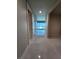 Inviting hallway featuring sleek tile flooring, neutral paint, and doors leading to various rooms with cityscape views beyond at 4525 Dean Martin Dr # 1507, Las Vegas, NV 89103