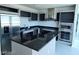 Modern kitchen with stainless steel appliances, black countertops and ample storage space at 4525 Dean Martin Dr # 1507, Las Vegas, NV 89103
