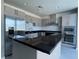 Contemporary kitchen boasts stainless steel appliances, dark countertops, and ample cabinet space for a modern, clean look at 4525 Dean Martin Dr # 1507, Las Vegas, NV 89103