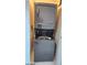 Efficient laundry closet featuring a stacked washer and dryer for space-saving convenience at 4525 Dean Martin Dr # 1507, Las Vegas, NV 89103