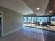 Bright living room with city views, recessed lights, tile floors, and a modern gray accent wall that adds sophistication at 4525 Dean Martin Dr # 1507, Las Vegas, NV 89103