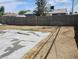 Spacious backyard area with partial concrete pad surrounded by dirt at 4525 Fulton Pl, Las Vegas, NV 89107