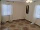 Bedroom featuring a decorative tile floor, bright windows with sheer curtains, and ceiling fan at 4525 Fulton Pl, Las Vegas, NV 89107