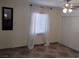 Bedroom featuring a window with sheer curtains, decorative flooring and a ceiling fan with lights at 4525 Fulton Pl, Las Vegas, NV 89107