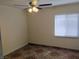 Bedroom with ceiling fan, tile floor, neutral paint and window with horizontal blinds at 4525 Fulton Pl, Las Vegas, NV 89107