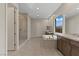 This primary bathroom showcases a soaking tub, large vanity, and glass-enclosed shower at 47 Garibaldi Way, Henderson, NV 89011