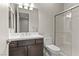 Modern bathroom featuring a glass shower enclosure and dark wood vanity at 47 Garibaldi Way, Henderson, NV 89011