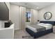 Relaxing bedroom with a plush blue bed and soft, neutral decor at 47 Garibaldi Way, Henderson, NV 89011