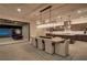 Open-concept dining area with elegant chandelier, large table and seating for eight at 47 Garibaldi Way, Henderson, NV 89011