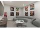 Entertainment room with comfortable seating and fun, colorful art at 47 Garibaldi Way, Henderson, NV 89011