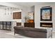 Stylish living room showcases fireplace, modern furnishings, and bar area at 47 Garibaldi Way, Henderson, NV 89011