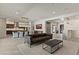 Open-concept living space with bar, dining area, and seamless flow into kitchen at 47 Garibaldi Way, Henderson, NV 89011