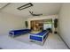 Covered patio with dual seating arrangement and a ceiling fan at 47 Garibaldi Way, Henderson, NV 89011