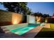 Backyard swimming pool with patterned tile and a fountain feature next to the patio at 47 Garibaldi Way, Henderson, NV 89011