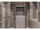 Walk-in closet featuring custom shelves and drawers for organized storage at 47 Garibaldi Way, Henderson, NV 89011