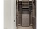 Walk-in closet featuring custom shelves and drawers for organized storage at 47 Garibaldi Way, Henderson, NV 89011
