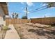 Fenced backyard featuring grass and a concrete walkway at 49 Constitution Ave, Henderson, NV 89015