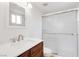 Bathroom featuring glass shower doors and a modern vanity with sink at 49 Constitution Ave, Henderson, NV 89015