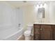 Bright bathroom featuring a tub with white tile surround and modern vanity at 49 Constitution Ave, Henderson, NV 89015