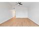 Bright, spacious bedroom with a ceiling fan and light wood floors at 49 Constitution Ave, Henderson, NV 89015