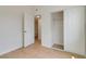 Bedroom with wood-look flooring, closet with sliding doors, and bathroom access at 49 Constitution Ave, Henderson, NV 89015