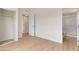 Bedroom with wood-look flooring, closet, and view of the en suite bathroom at 49 Constitution Ave, Henderson, NV 89015
