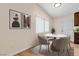 Cozy dining room with a modern round table and matching chairs at 49 Constitution Ave, Henderson, NV 89015