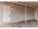 Covered entrance featuring a white door and textured wall at 49 Constitution Ave, Henderson, NV 89015