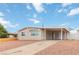 Charming single-story home with a covered parking area and low-maintenance landscaping at 49 Constitution Ave, Henderson, NV 89015