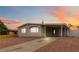 Charming single-story home with a covered parking area and low-maintenance landscaping at 49 Constitution Ave, Henderson, NV 89015