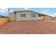 Charming single-story home with a covered parking area and low-maintenance landscaping at 49 Constitution Ave, Henderson, NV 89015