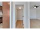 Hallway with open door and view of the living room at 49 Constitution Ave, Henderson, NV 89015