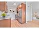 Modern kitchen with stainless steel appliances, granite countertops, and wood-look flooring at 49 Constitution Ave, Henderson, NV 89015