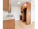 Updated kitchen featuring granite counters, wood cabinets, and stainless steel sink at 49 Constitution Ave, Henderson, NV 89015