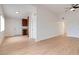 Spacious living area with light wood floors and open access to kitchen at 49 Constitution Ave, Henderson, NV 89015