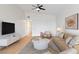 Bright living room with ceiling fan, contemporary decor and light wood floors at 49 Constitution Ave, Henderson, NV 89015