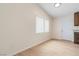 Bright living room featuring wood-look floors, neutral walls, and a window with blinds at 49 Constitution Ave, Henderson, NV 89015