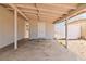 View of the covered patio with concrete floor and wood ceiling beams at 49 Constitution Ave, Henderson, NV 89015