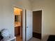 Bathroom and closet are featured side-by-side in a well-lit space with neutral tones and a bright vanity at 5043 Gable Crest Ct, Las Vegas, NV 89141