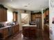 Well-lit kitchen featuring wooden cabinets, stainless steel appliances, and a central island with bar seating at 5043 Gable Crest Ct, Las Vegas, NV 89141
