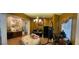 Unique living space decorated with eclectic art, a chandelier, and a piano beside a comfortable beanbag at 5043 Gable Crest Ct, Las Vegas, NV 89141