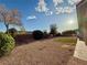 Expansive backyard with desert landscaping and blue skies at 5451 Fernwood Ct, Pahrump, NV 89061