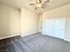 Comfortable bedroom with carpet flooring, ceiling fan, and a closet at 5451 Fernwood Ct, Pahrump, NV 89061