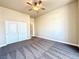 Comfortable bedroom with carpet flooring, ceiling fan, and a closet at 5451 Fernwood Ct, Pahrump, NV 89061