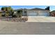 Beautiful one-story home with desert landscaping and a long driveway at 5451 Fernwood Ct, Pahrump, NV 89061