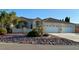 Stunning single-story home with a three-car garage and desert landscaping at 5451 Fernwood Ct, Pahrump, NV 89061